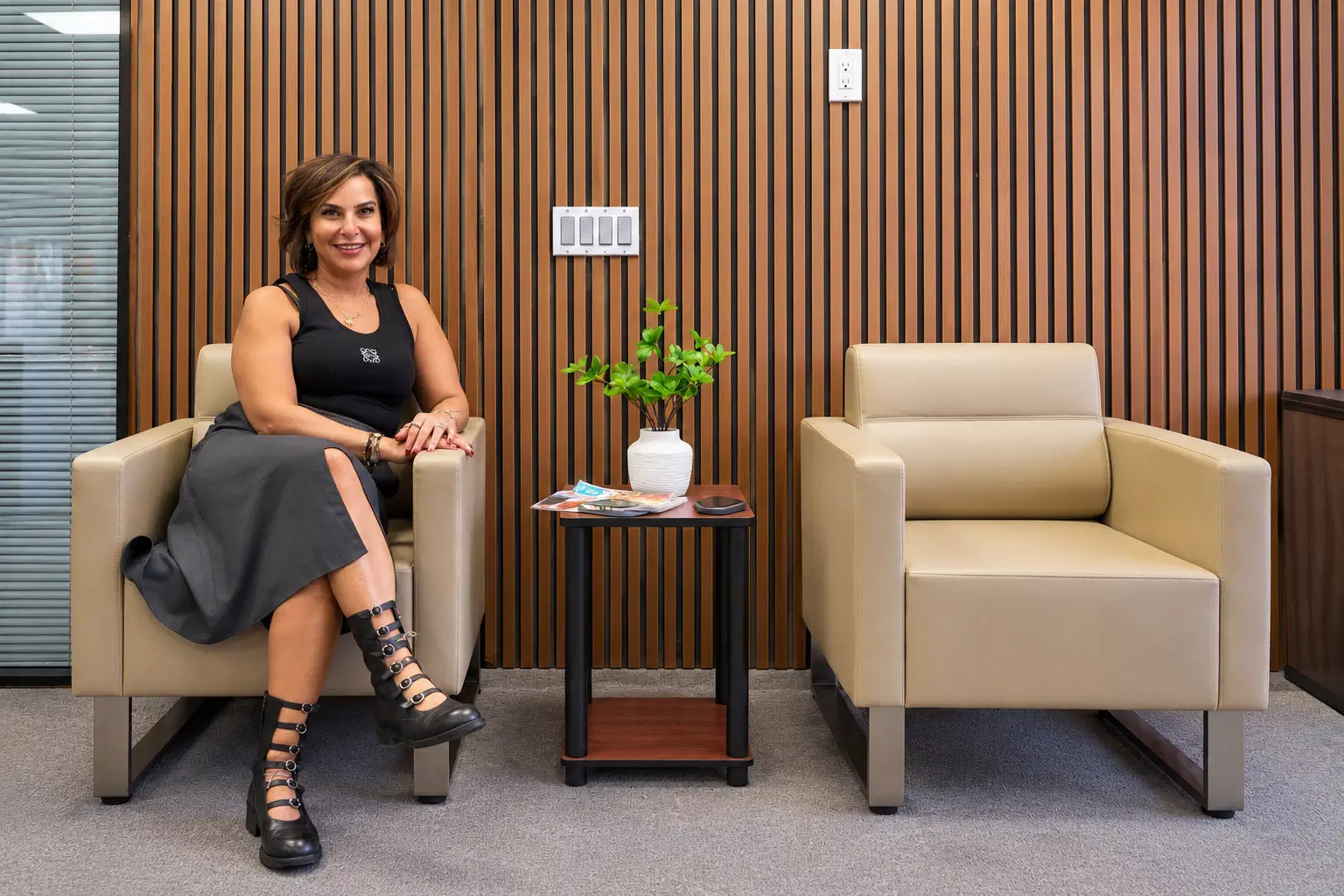 A clinician seated in a bright, comfortable office